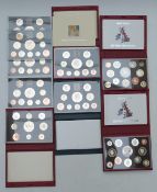 A collection of Royal Mail United Kingdom proof coins / coin sets including five Deluxe editions for