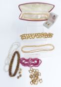 A collection of jewellery including faux pearls, 9ct gold earrings set with garnets and pearls (3.