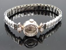 Certina 18ct gold ladies wristwatch with two diamonds set to the case, blued hands, baton hour