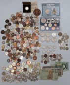 A collection of UK and overseas coinage, includes redeemable examples, banknotes etc, small silver