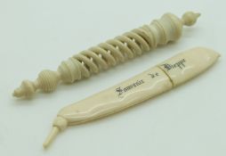 Two 19thC carved ivory needle cases comprising 'Souvenir de Dieppe' pea pod and a spirally carved