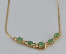 A 9ct gold necklace set with emeralds and diamonds, 4.2g