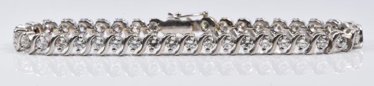 An 18ct white gold tennis bracelet set with 41 round cut diamonds each approximately 0.1ct, total