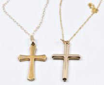Three 9ct gold chains and two 9ct gold cross pendants, 3.1g