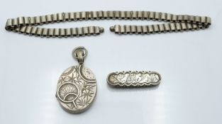Victorian locket with bird and foliate decoration and chain, and another Victorian brooch with