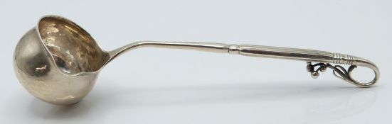 Georg Jensen hallmarked silver sauce / brandy ladle with decorative floral handle, probably lily-