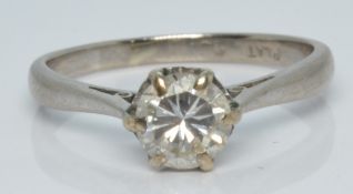 A 18ct gold ring set with a round cut diamond of approximately 0.55ct in a platinum setting, 2.6g,