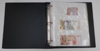 An album of thirty uncirculated world banknotes