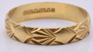 An 18ct gold ring/band, 2.2g, size N/O