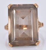 A 9ct gold ring set with a smoky quartz, 7.7g, size O