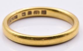 A 22ct gold wedding band/ ring by Mappin & Webb, 4.1g, size M