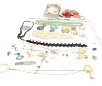A collection of jewellery including beads, filigree, beetle necklace, vintage brooches etc