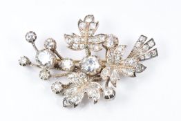 Victorian brooch of foliate design set with old European cut diamonds, the largest approximately 1.