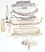 A collection of beads, a silver cameo brooch, Siam silver cufflinks, filigree butterfly brooch etc