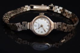 Rotary 9ct gold ladies wristwatch with gold hands and hour markers, silver dial and 21 jewel