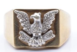 A 9ct gold signet ring depicting an eagle set with diamonds , 6.7g, size T