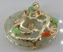 A 9ct gold pendant set with jadeite with dragon decoration