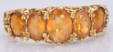 A 9ct gold ring set with five oval cut citrines, 3.5g, size M/N