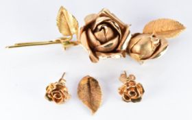 Yellow metal brooch in the form of a rose (16.5g) and similar 9ct gold earrings (2.8g)