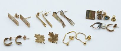 A pair of 14k gold earrings (1.8g) and a collection of 9ct gold earrings including tri-coloured