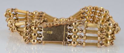 Edwardian 15ct gold bracelet, with links made up of four reeded bars interspersed with spheres, 23.