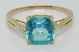A 10k gold ring set with a Batalha topaz and diamonds, with certificate, size U