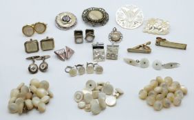 A pair of white metal cufflinks set with mother of pearl, further mother of pearl cufflinks, a