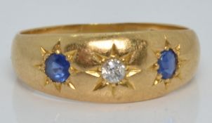 Edwardian 18ct gold ring set with a diamond and two sapphires in star settings, Chester 1909, 3.