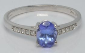 A 10k gold ring set with tanzanite and zircons, with certificate, size U