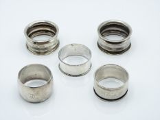 Five various hallmarked silver napkin rings including a pair, weight 66g