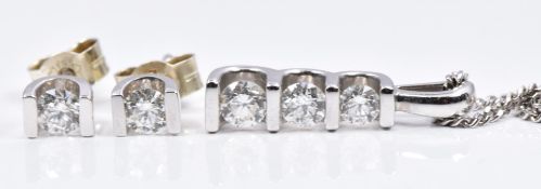 A 9ct white gold pendant set with three diamonds total diamond weight approximately 0.4ct, with