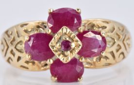 A 9ct gold ring set with rubies with engraved shoulders, 3.5g, size N