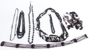A collection of French jet and Art Deco jet including necklaces, belts etc