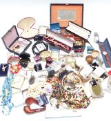 A collection of costume jewellery including cameos, filigree brooch, pearl necklace etc