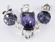 A 9ct white gold pendant set with blueberry quartz and zircon and a pair of 9ct white gold
