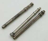 Three Samuel Mordan & Co white metal propelling pencils, all with engraved detail and marked 'S