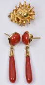 A pair of 18ct gold earrings each set with a coral cabochon and a further tear shaped coral bead,