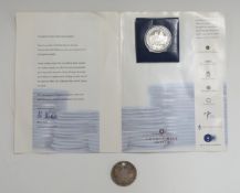 A silver Trafalgar crown and a holed Maria Theresia