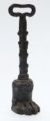 19th or early 20thC cast iron door porter/ stop with lion pad foot, height 35cm