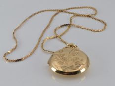 A 9ct gold locket and chain, 13.2g