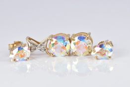 A 9ct gold pendant set with two round cut moonlight topaz and diamonds together with a pair of 9ct