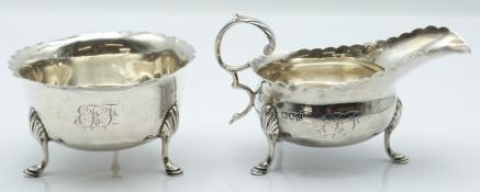 Victorian hallmarked silver sauce boat and sugar bowl, both with wavy edge and raised on three feet,