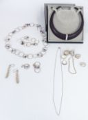 Four silver rings, a matching silver necklace and bracelet, two silver bracelets etc