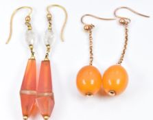 A pair of Art Deco 9ct gold earrings set with amber drops and a similar pair