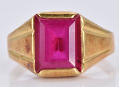 An 18ct gold ring set with an emerald cut synthetic ruby, 5.5g, size P