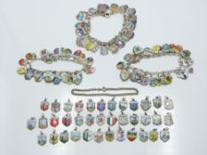 Three silver charm bracelets with a large quantity of enamel charms, 159g