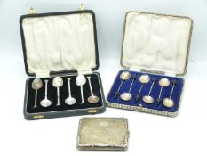 Two cased sets of hallmarked silver spoons, weight 89g, together with a silver plated cigarette case
