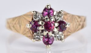 A 9ct gold ring set with diamonds and rubies, 2.7g, size K/L