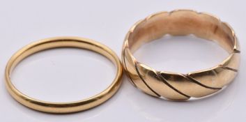 A 9ct gold ring/ band (2.6g, size K) and an 18ct gold wedding band (1.3g, size K)