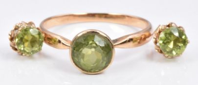 A 9ct gold ring set with a peridot, and similar earrings, 3.1g